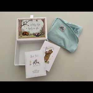 Ollie Baby Swaddle with original packaging in light blue